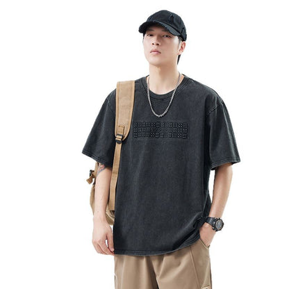 T-shirt homme décontracté polyvalent en noir avec manches courtes et design tendance.