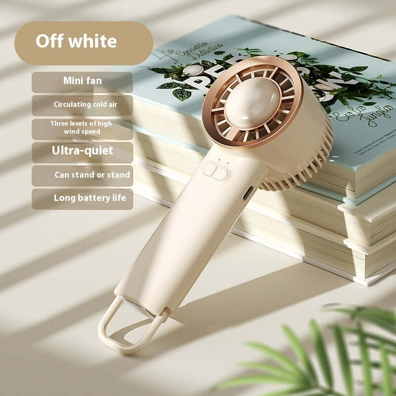 Off white mini fan with digital display, ultra-quiet, multiple speed settings, standing or handheld design.