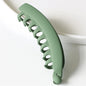 Barrette cheveux banane couleur unie verte en plastique de haute qualité, idéale pour coiffures élégantes.