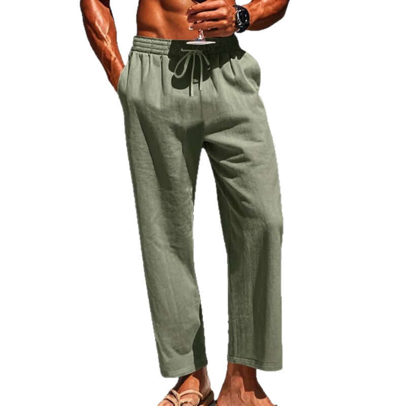 Pantalons en lin mi-hauteur pour hommes de couleur vert clair avec taille élastique et cordon de serrage.