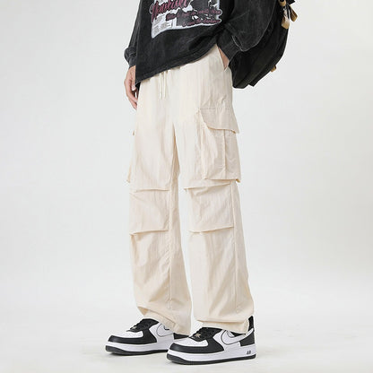 pantalons d'été en soie glacée pour hommes avec poches, coupe décontractée, couleur crème.