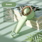 Mini portable fan in green with digital display, featuring ultra-quiet operation and three speed settings.